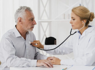 doctor-auscultating-patient